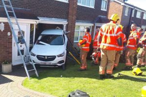 elderly-driver-tries-to-back-out-of-his-driveway-ends-up-in-neighbors-home-133715_1