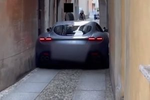ferrari roma stuck in tight street of italy
