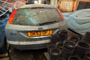 abandoned-peugeot-205-gti-sleeping-under-a-tarp-be (2)