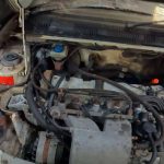 abandoned-peugeot-205-gti-sleeping-under-a-tarp-be (3)