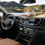 The interior of the 2021 Chrysler Pacifica Pinnacle model includes a new integrated Ultra console, the all-new Uconnect 5 system with a 10.1-inch touchscreen that delivers the largest standard touchscreen in its class and new accent points, including Caramel Nappa leather seats and a Mid-century Timber Hydro bezel.