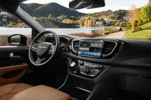 The interior of the 2021 Chrysler Pacifica Pinnacle model includes a new integrated Ultra console, the all-new Uconnect 5 system with a 10.1-inch touchscreen that delivers the largest standard touchscreen in its class and new accent points, including Caramel Nappa leather seats and a Mid-century Timber Hydro bezel.