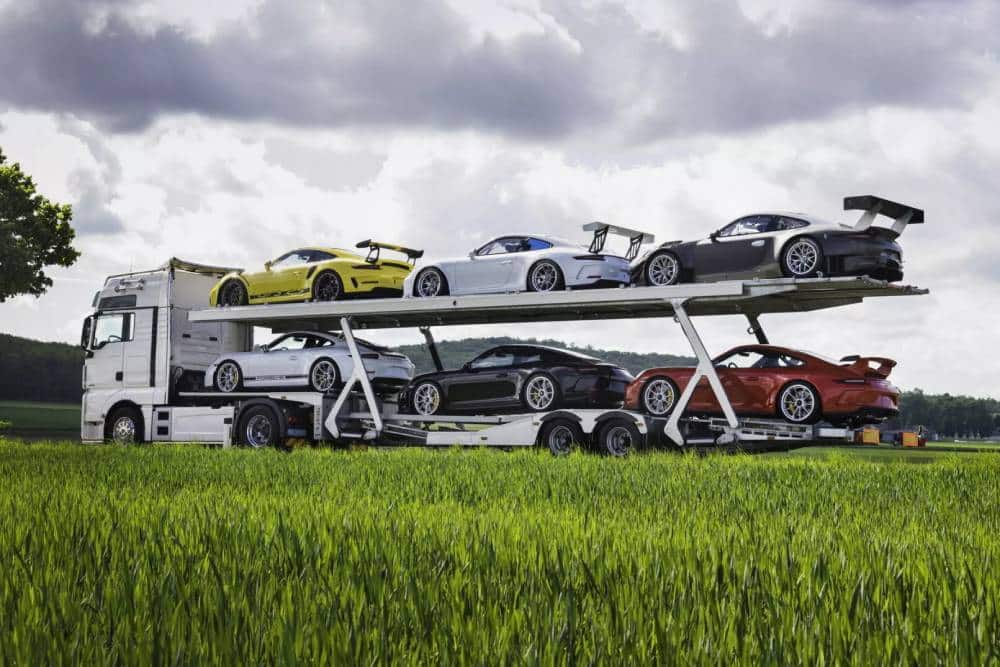 https://autogreeknews.gr/wp-content/uploads/2025/03/Six-Cars-One-Truck-The-Delivery-Mileage-Porsche-Co.jpg
