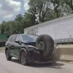 runaway tire smashes nissan